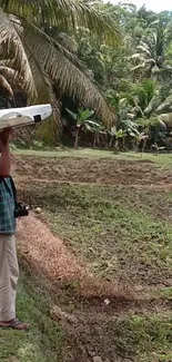 Man in field launching a white drone amid greenery.