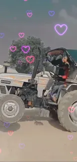 A tractor in a rural setting with pink heart overlays.