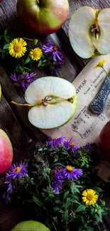 Sliced apples and flowers with rustic wood background.