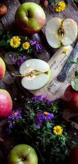 A vibrant still life of apples and flowers on a rustic wooden table.