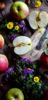 Rustic arrangement of fresh apples and flowers on a wooden surface.