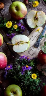 Rustic apples and flowers on a wooden table with vintage knife.