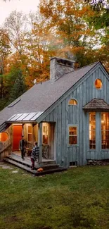 Rustic cottage surrounded by autumn trees with a cozy, inviting atmosphere.