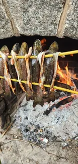 Fish roasting by an open fire in rustic style.