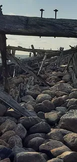 Rustic wooden pier on sandy beach at sunset with ocean waves.