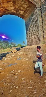 Rustic stone bridge under vivid sky with light aura.