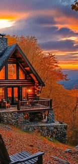 Rustic cabin surrounded by vibrant autumn trees at sunset.
