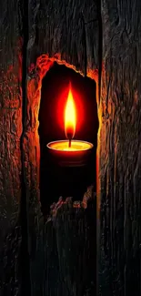 Candle flame nestled in rustic wood texture.