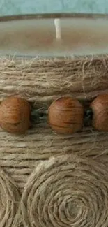 Rustic candle wrapped in twine and wooden beads mobile wallpaper.