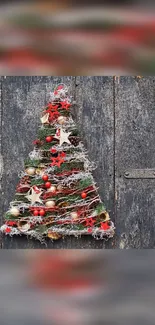 Rustic Christmas tree on wooden door background.