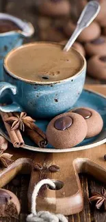 Blue coffee cup with cookies on rustic wooden board.