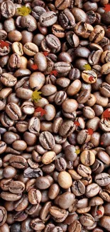 Close-up of roasted coffee beans forming a textured wallpaper pattern.