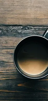 Dark coffee mug on rustic wooden table setting.