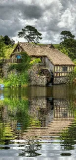 Rustic cottage by lake with reflection, lush greenery and cloudy sky.