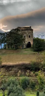 Rustic stone house amidst lush greenery under dramatic skies.