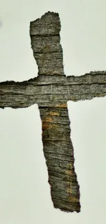 Cross cutout on rustic wood background wallpaper.