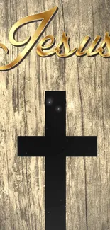 Rustic cross on wood with golden 'Jesus' text.