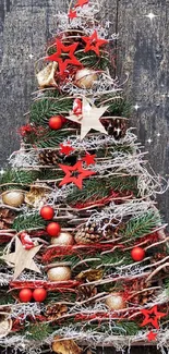 Rustic Christmas tree on vintage wooden door with red stars.