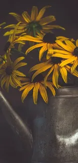 Yellow flowers in a vintage metal teapot.