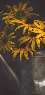 Yellow flowers in a vintage kettle on a dark background.