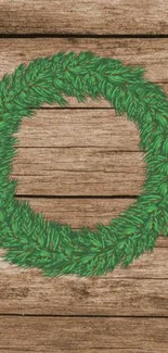 Rustic green wreath on wooden background wallpaper.