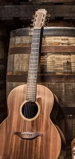 Acoustic guitar leaning against rustic wooden barrels.