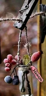 Small hanging jar with fruits and twine in rustic style.