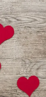 Rustic wood wallpaper with red hearts pattern.