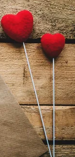 Red hearts on a wooden background, rustic charm.