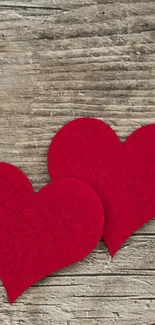 Rustic wooden background with red hearts.