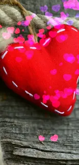 Red heart on wood with pink heart overlays.