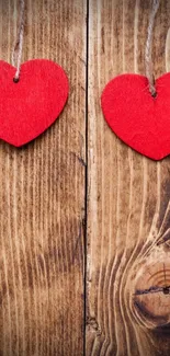 Rustic wood wallpaper with red hearts.