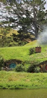 Hobbiton landscape with green hills and hobbit homes by a pond.