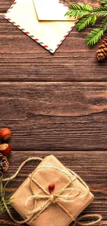 Rustic holiday wallpaper with wood, pine cones, and wrapped gift.