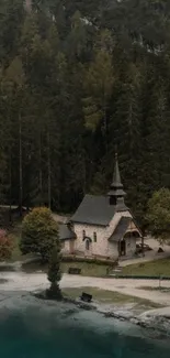 Lakeside chapel surrounded by forest and water.