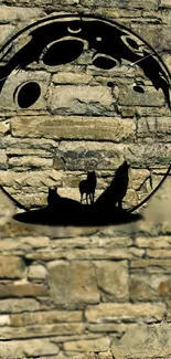 Stone wall with silhouettes of wolves howling at a moonlit sky.