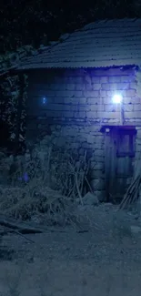 Rustic cabin illuminated by soft blue light at night.