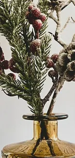 Rustic pinecone and evergreen branch in stylish vase.