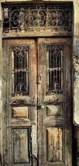 A rustic and vintage wooden door with intricate design and weathered details.