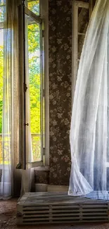 Rustic window with sheer curtains and a floral wallpaper design.