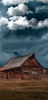 Rustic wooden barn under dramatic clouds.
