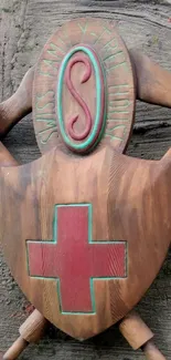 Rustic wooden shield with red cross emblem on textured background.