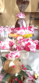 Sacred floral arrangement with roses and spiritual elements.