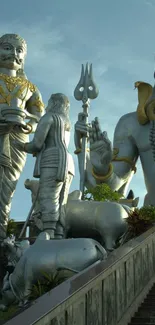 Majestic Indian statues with clear sky background.