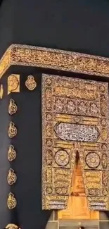 Close-up of the Kaaba with gold ornamentation and black fabric. Iconic Islamic site.