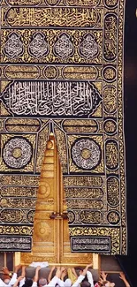 Detailed view of the sacred Kaaba door in black and gold.