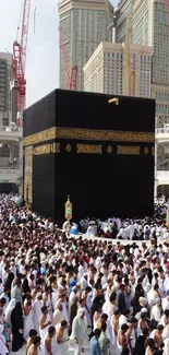 Pilgrims gathered around the Kaaba in Mecca, showcasing sacred architecture.