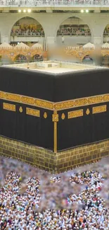 Kaaba in Mecca surrounded by numerous pilgrims in the mosque.