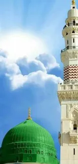 Beautiful mosque tower touching a bright blue sky with clouds.