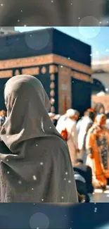 A person gazing at the Kaaba during pilgrimage.